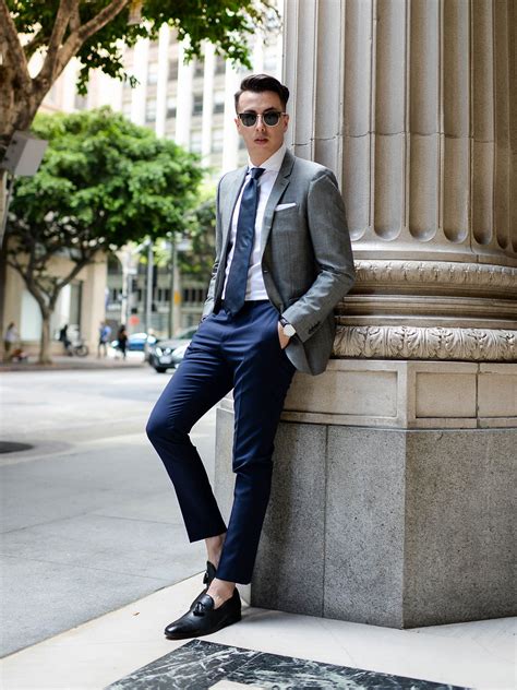 navy jacket with grey pants